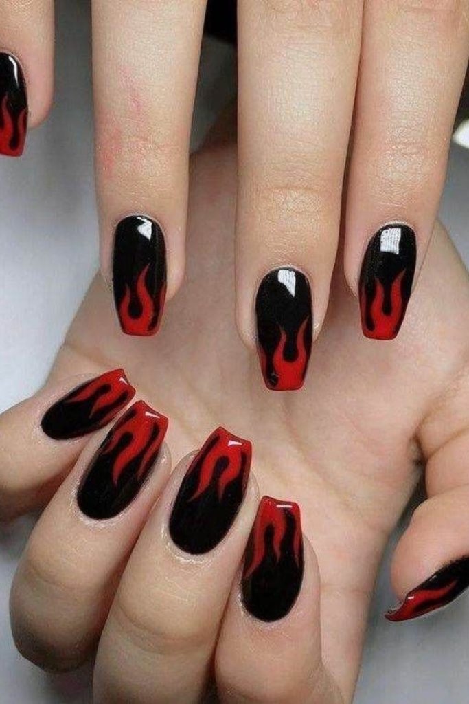 Gothic red flames on black nails.