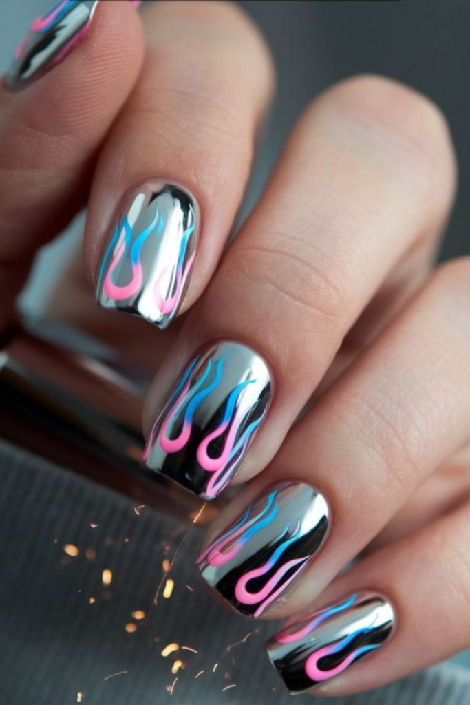 Purple flames on glossy black nails.