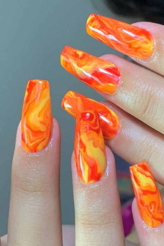 Fiery red yellow chaotic painted nails
