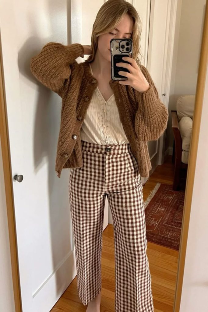 Beige cardigan plaid trousers outfit.