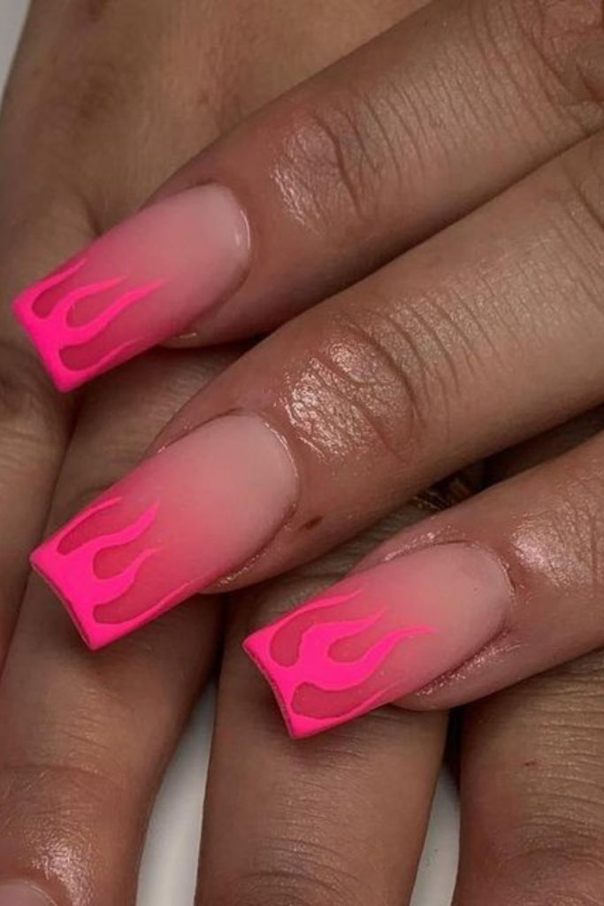Peach matte nails with soft flames.