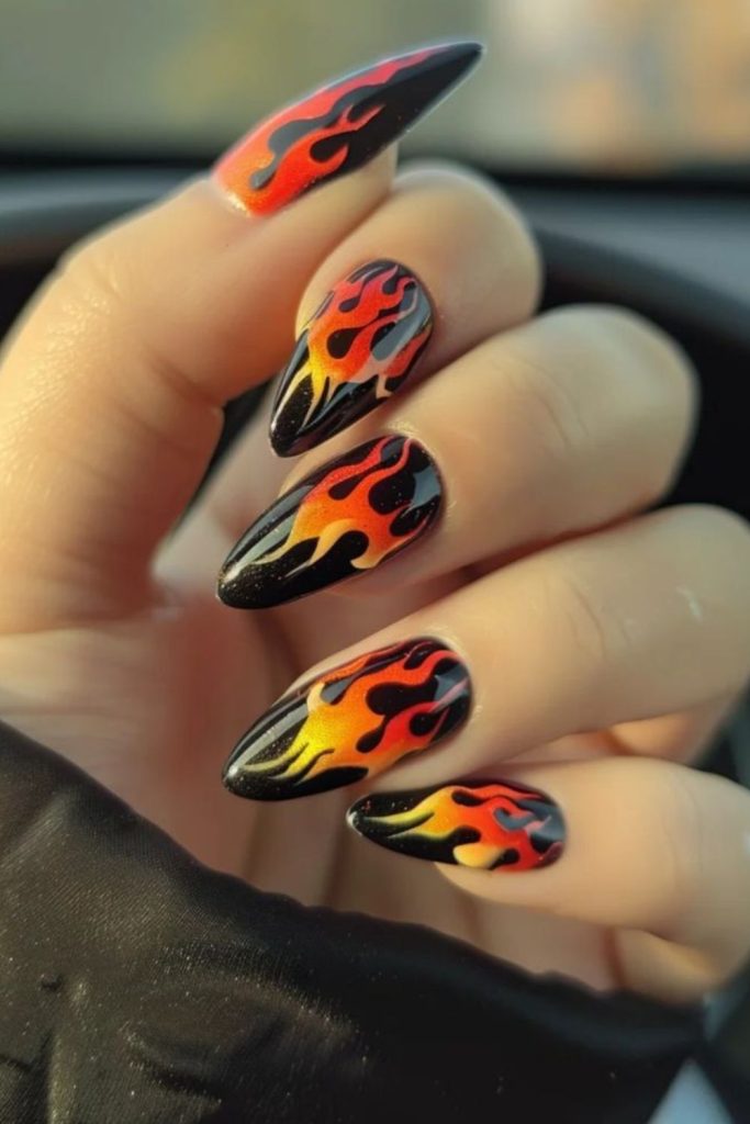 Black nails flickering with fiery streaks