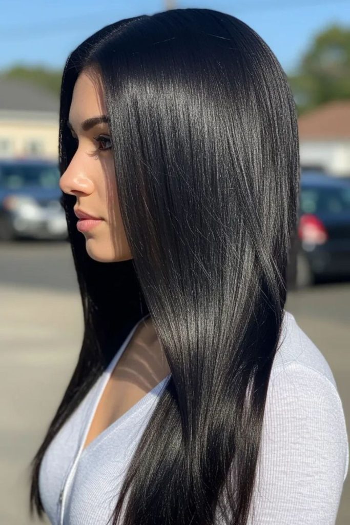 Jet-black hair with subtle flicks