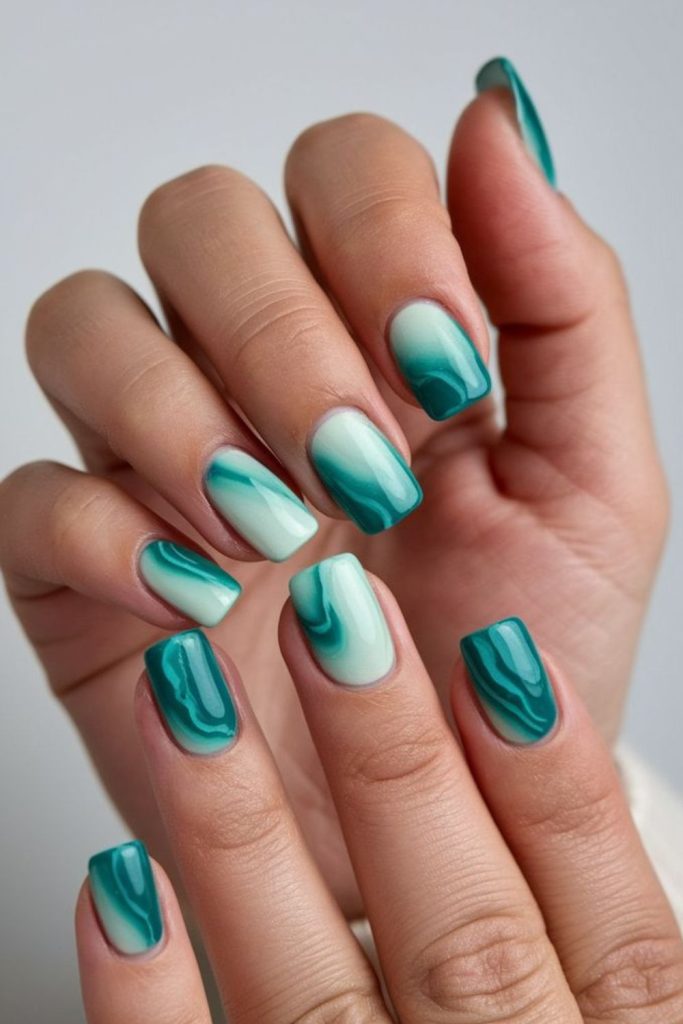 Blue-green nails with white streaks