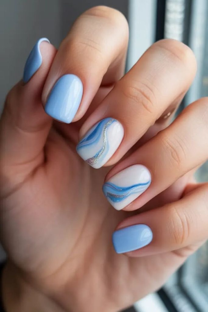 Soft blue wave-inspired nail design