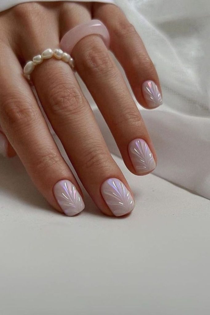 Iridescent crushed shell nail design
