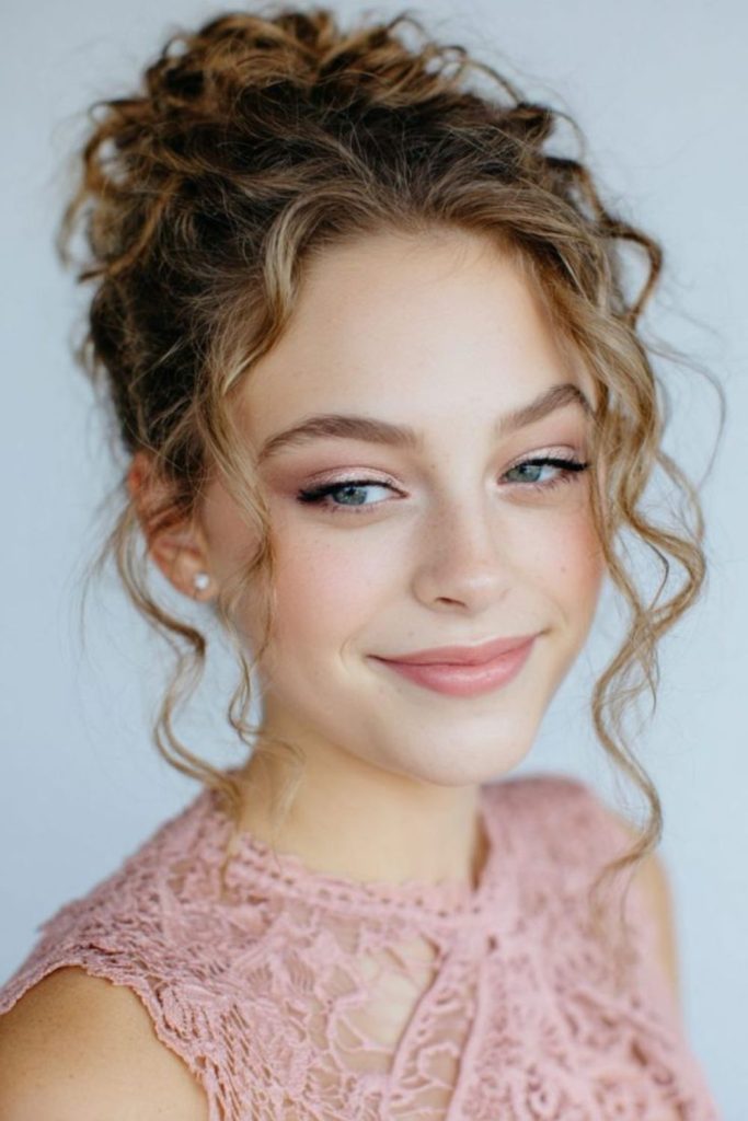 Romantic rose inspired twisted updo style.