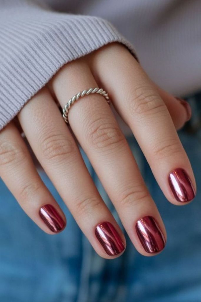 Deep ruby nails with metallic shine.