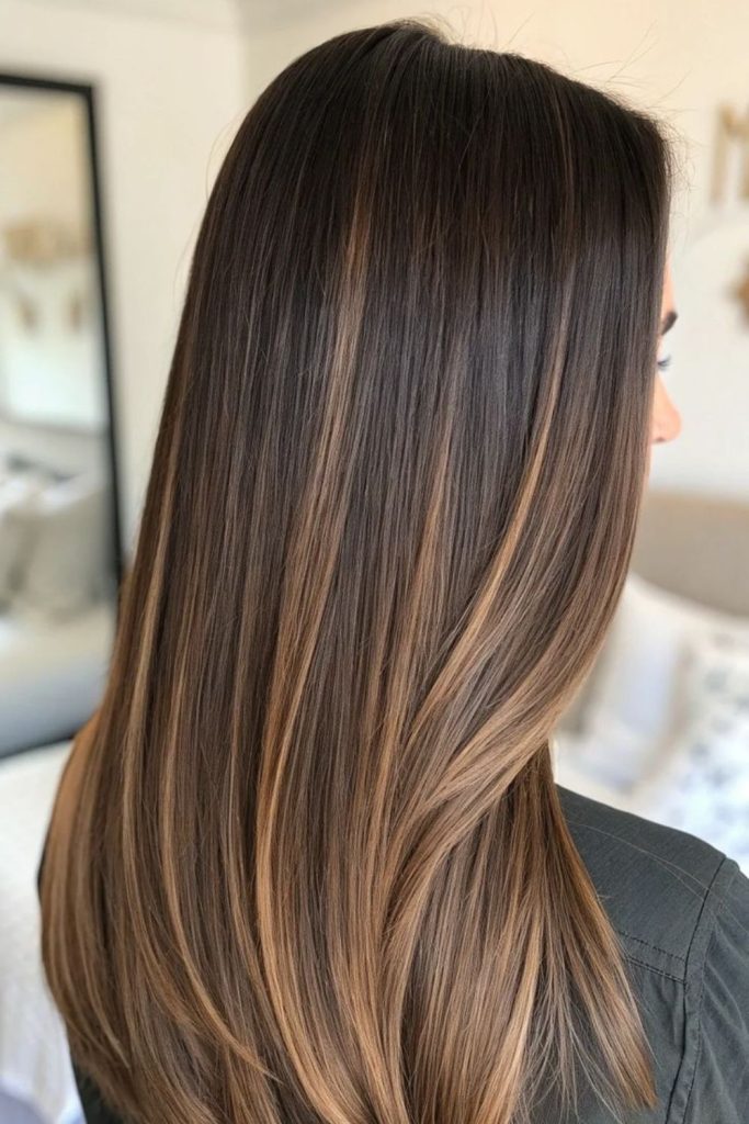 Honey fusion highlights in sable brown hair.