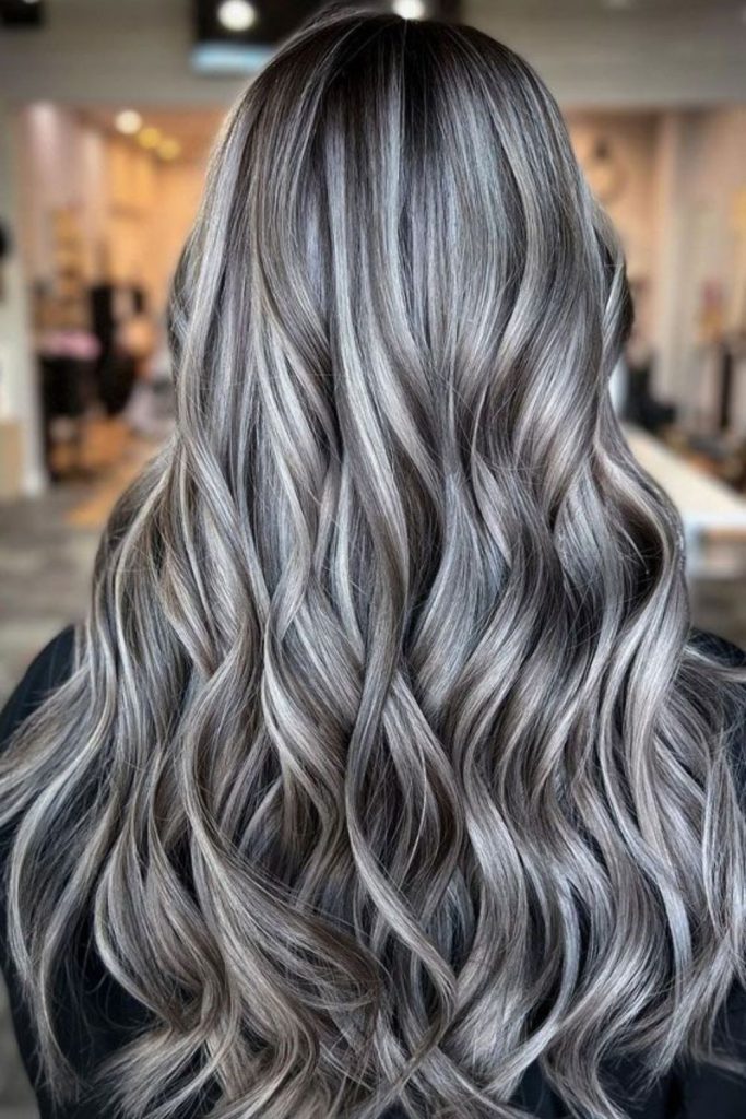 Platinum ash highlights on dark hair.