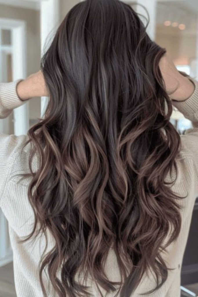 Smoky cocoa brown hair with diffused highlights.