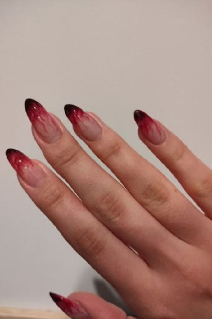 Smoky ombre flames on almond nails.