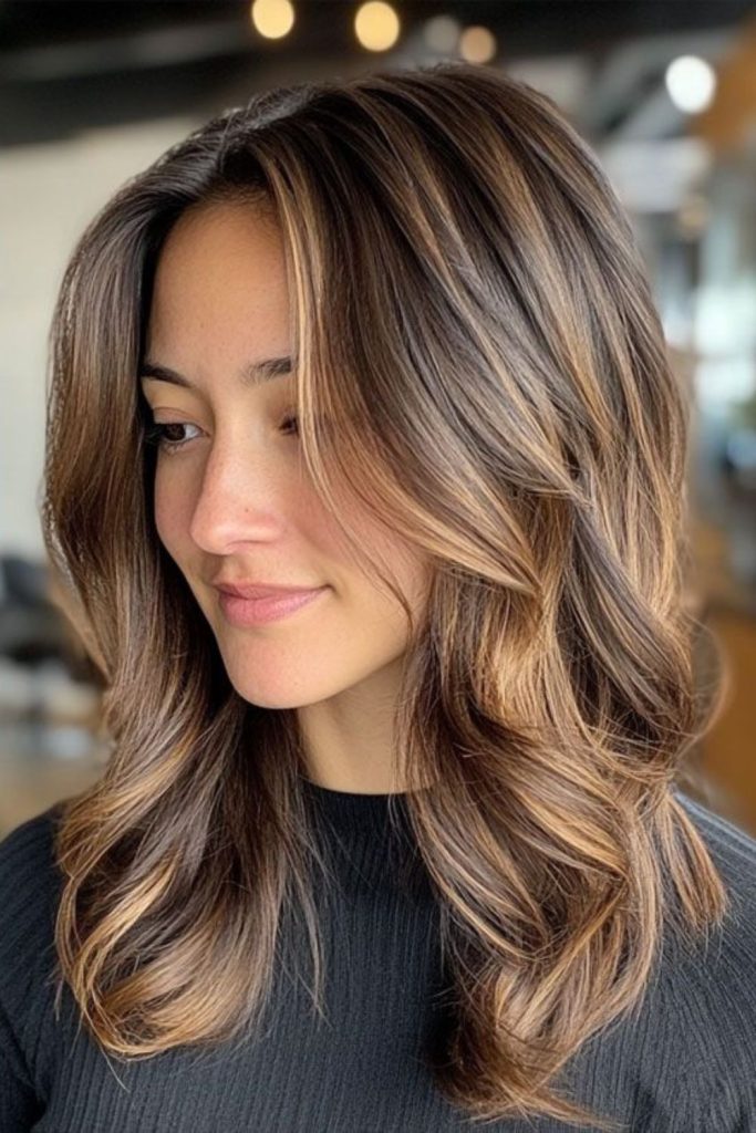 Mocha brown hair with soft halo highlights.