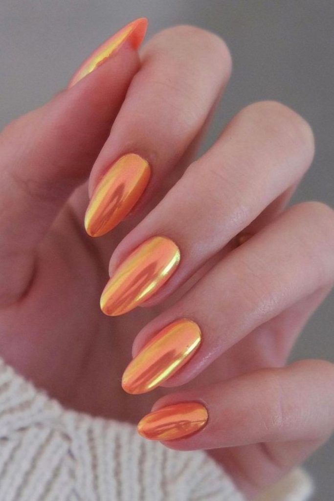 Fiery yellow-orange nails erupting brilliance