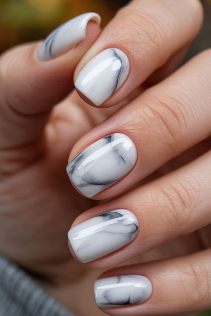 Light nails with dark speckles