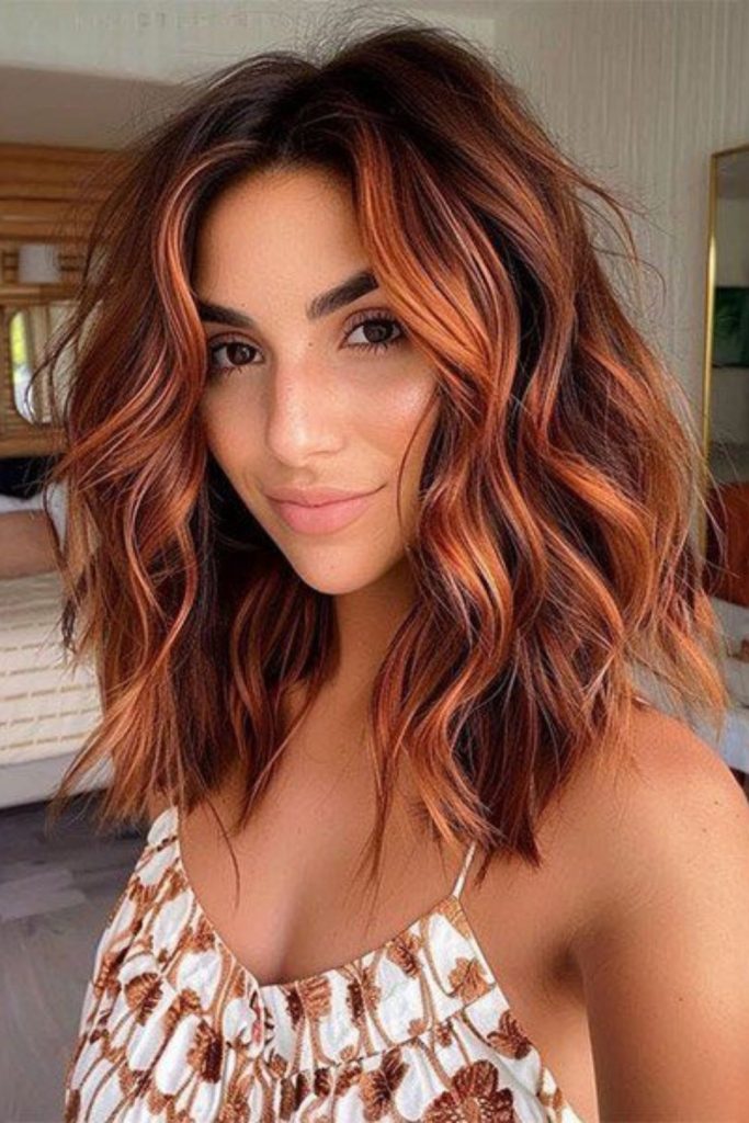 Spiced maple wavy red brown hair.