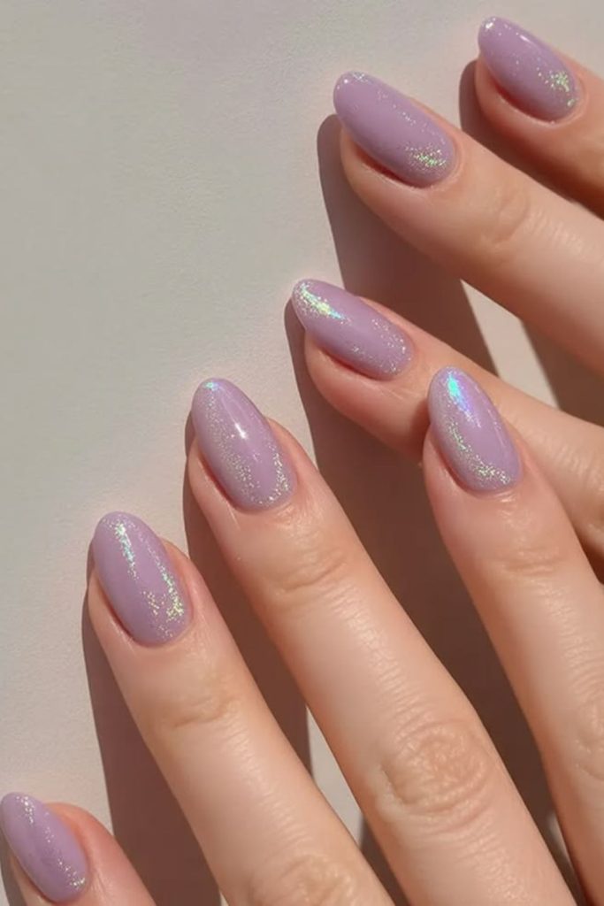 Lilac nails sprinkled with delicate stardust