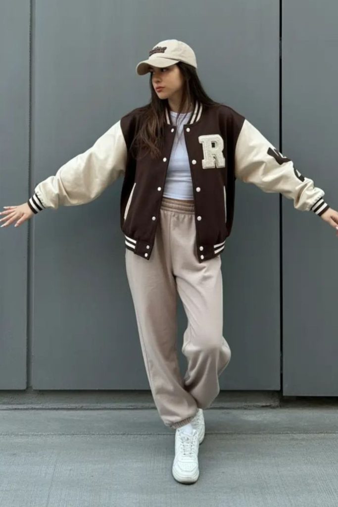 Varsity jacket cargo pants outfit.