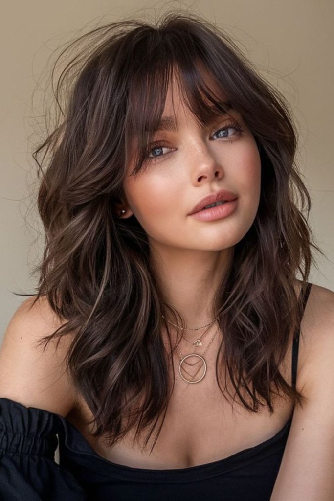 Curtain bangs with tousled mid-length hair