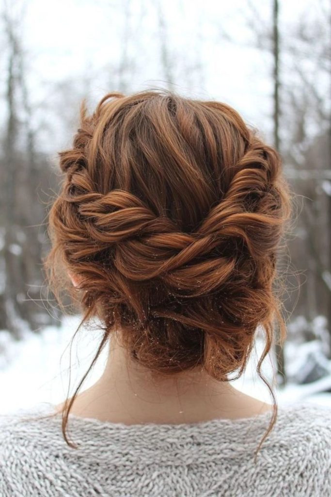 Elegant twisted updo with soft tendrils.