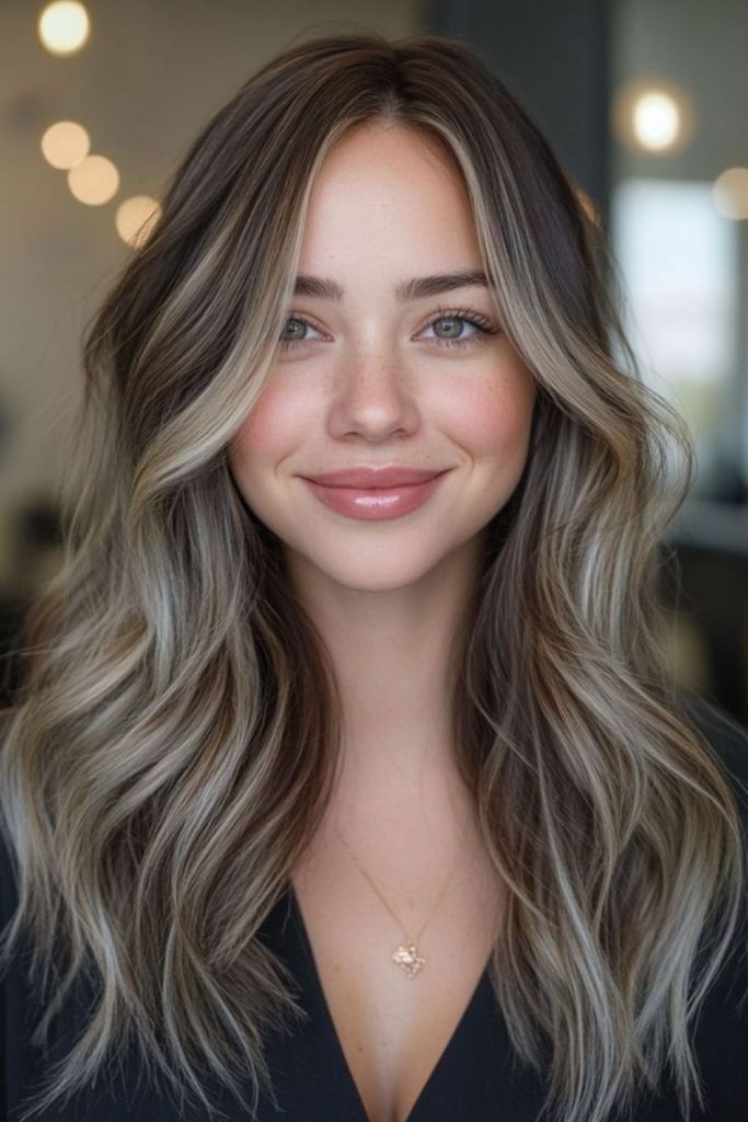 Thin ash blonde threads dark hair.