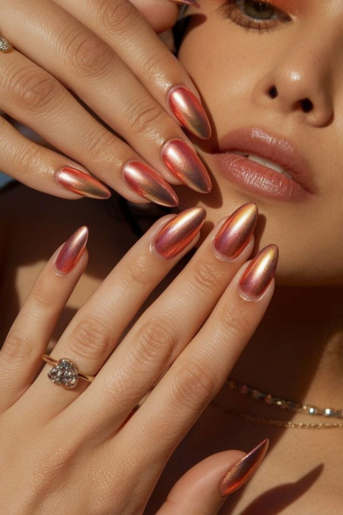 Apricot chrome soft metallic glowing nails.