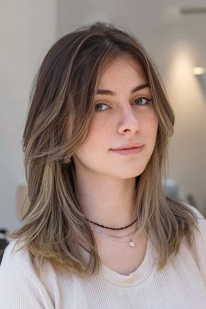 Aurora Flick butterfly layered voluminous style.