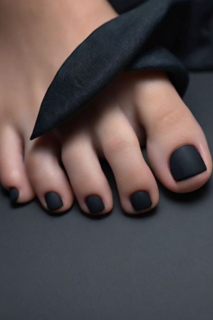 Black matte sleek minimal toenail style