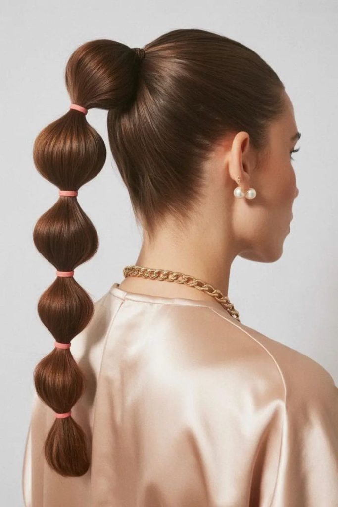 High ponytail bubbly lifted pool hair.