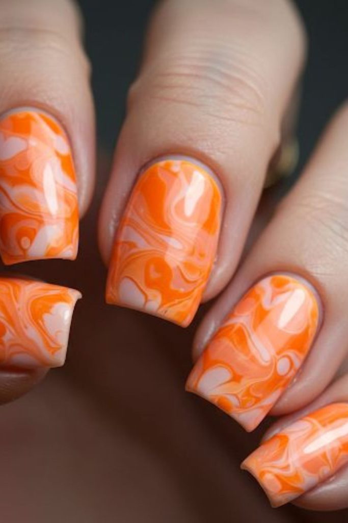Citrus marble luxury orange glossy nails.