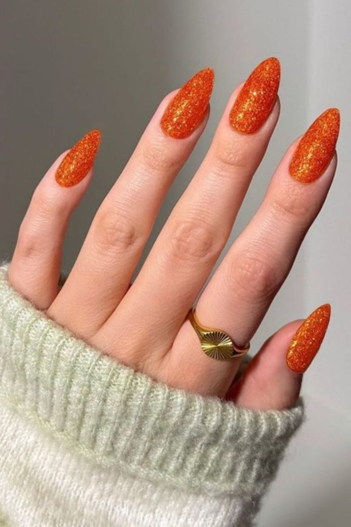 Citrus confetti orange playful glitter nails.