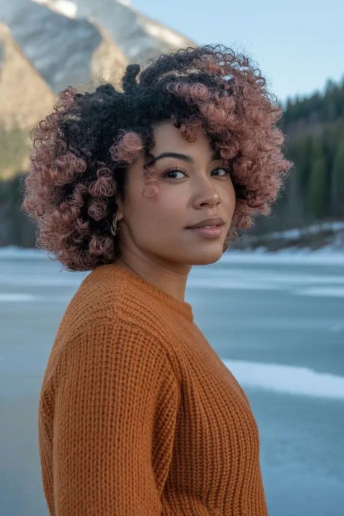 Afro puff voluminous soft rounded shape.