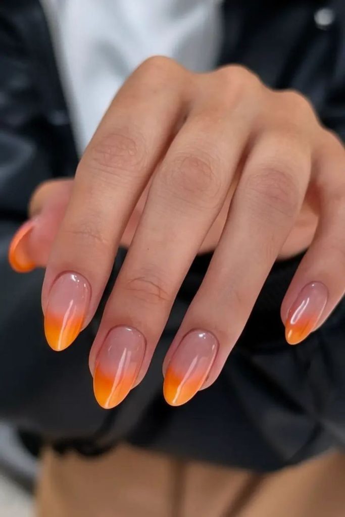 Flame tip orange accent bold nails.