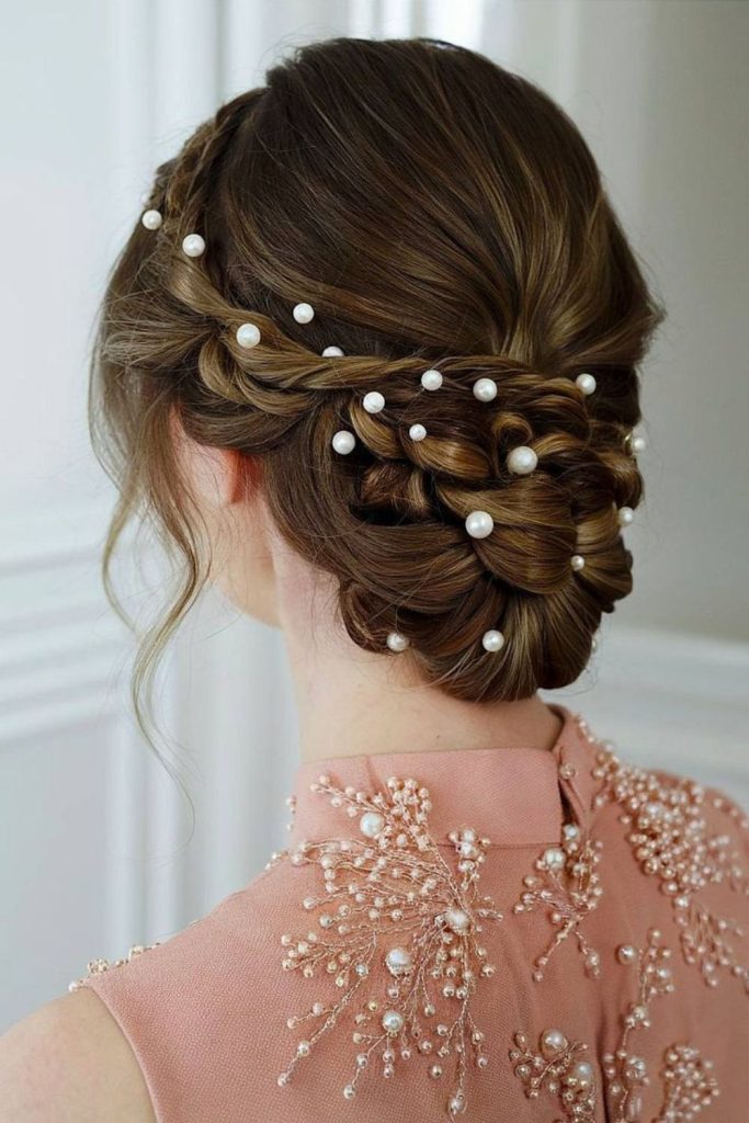 Side bun pearl accented soft style