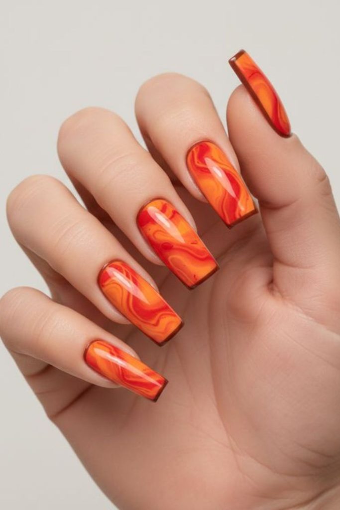 Lava marble orange swirling glossy nails.