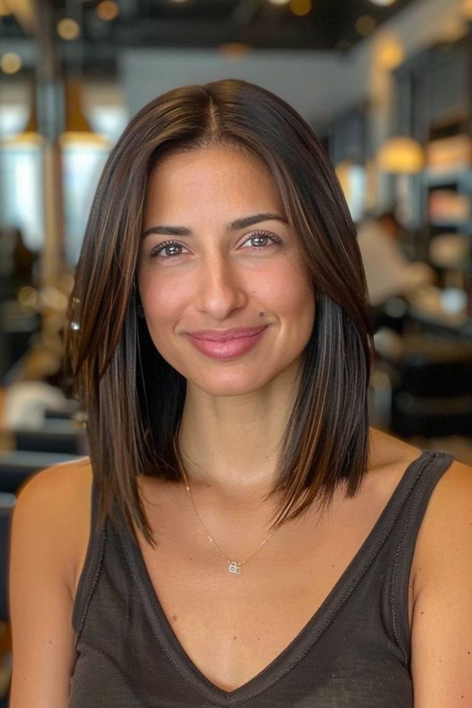 Sleek straight medium lob shiny finish