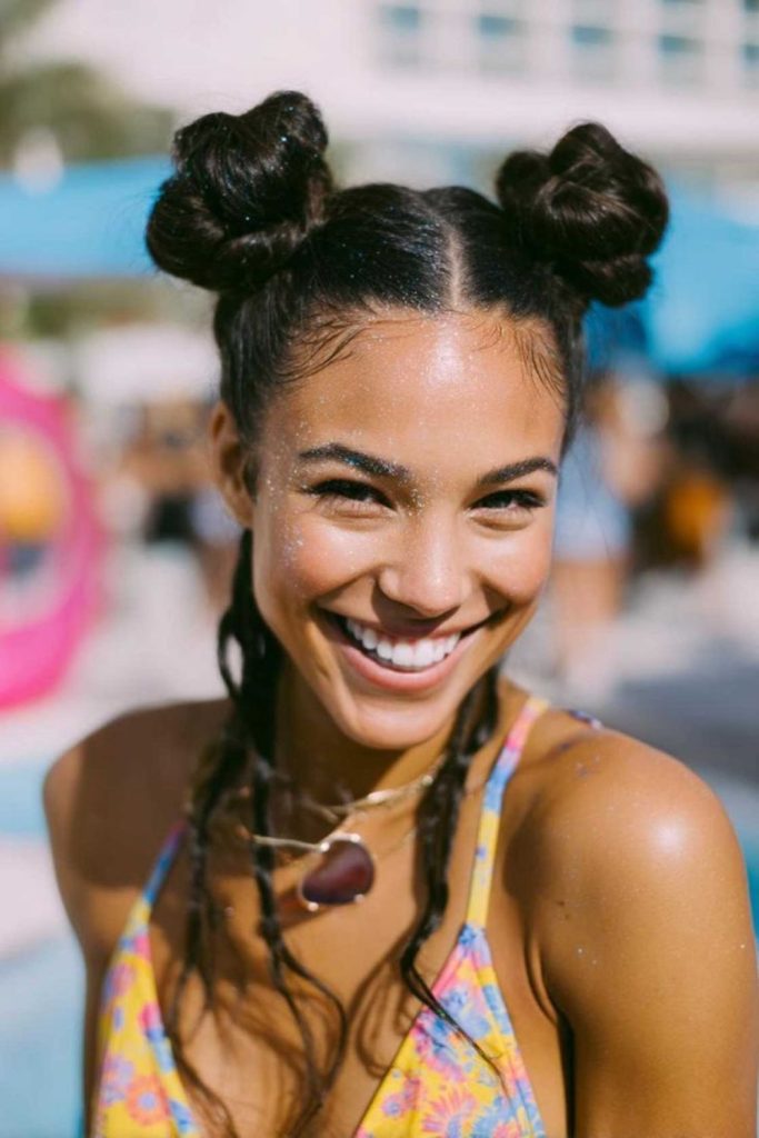 Double buns playful neon pool hairstyle.