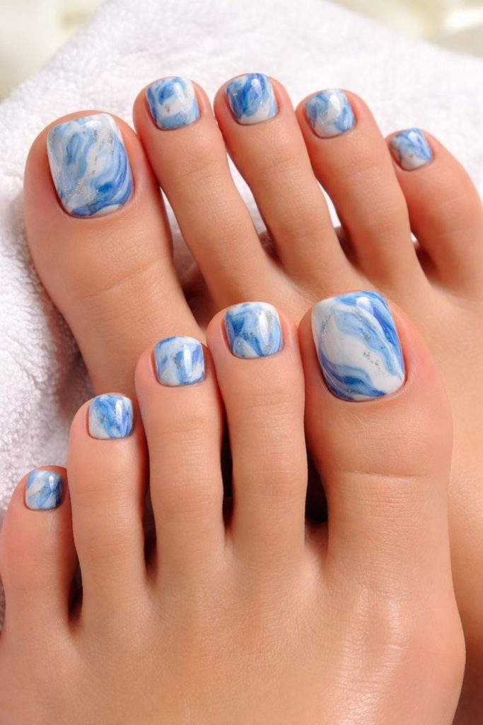 Ocean blue ink swirl toenail art