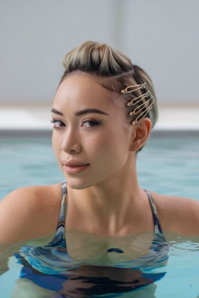 Short slick pixie poolside hair look.