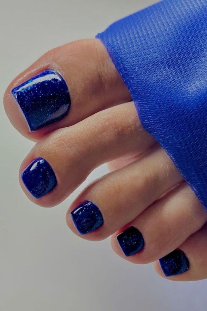 Sapphire blue glossy rich toenail design