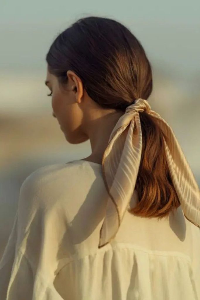 Low tie silky ribbon elegant hairstyle.