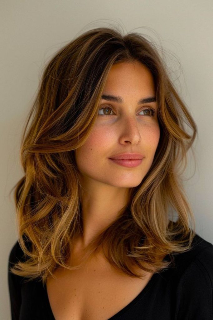 Starfire layered blowout with voluminous flicked ends