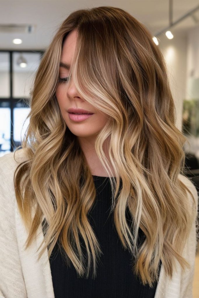 Sunlit honey balayage soft flowing waves