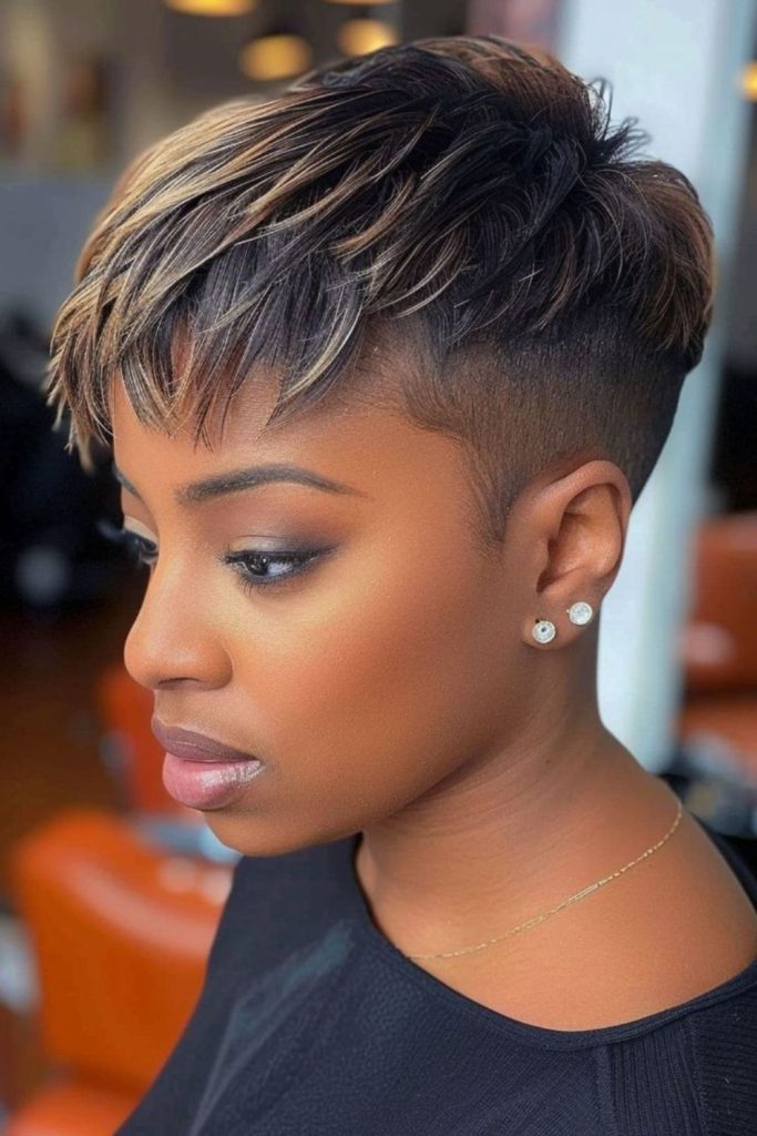 Amber toned pixie cut with flicked layers and bright lively movement.