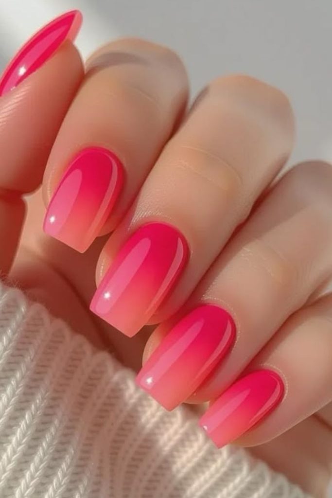 Vibrant coral pink glossy nail design