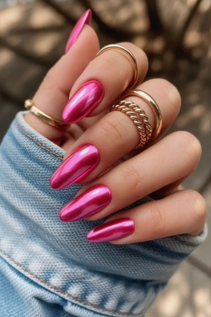 Glittery pink Barbie-inspired baddie nails.