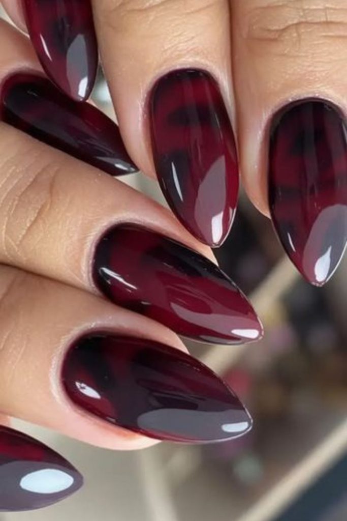 Black cherry aura swirl manicure style