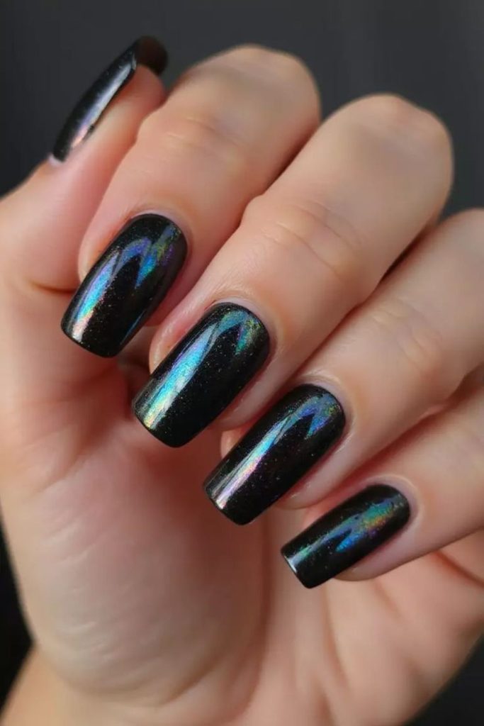 Icy black holographic shimmer almond nails
