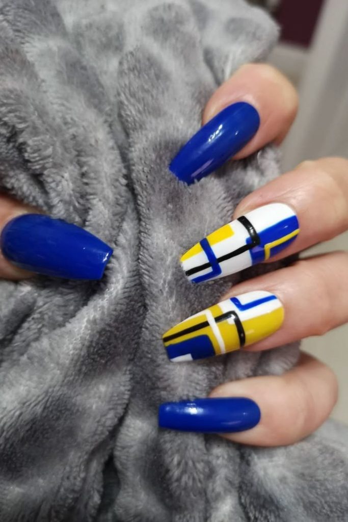 Blue nails with neon yellow digital grid.