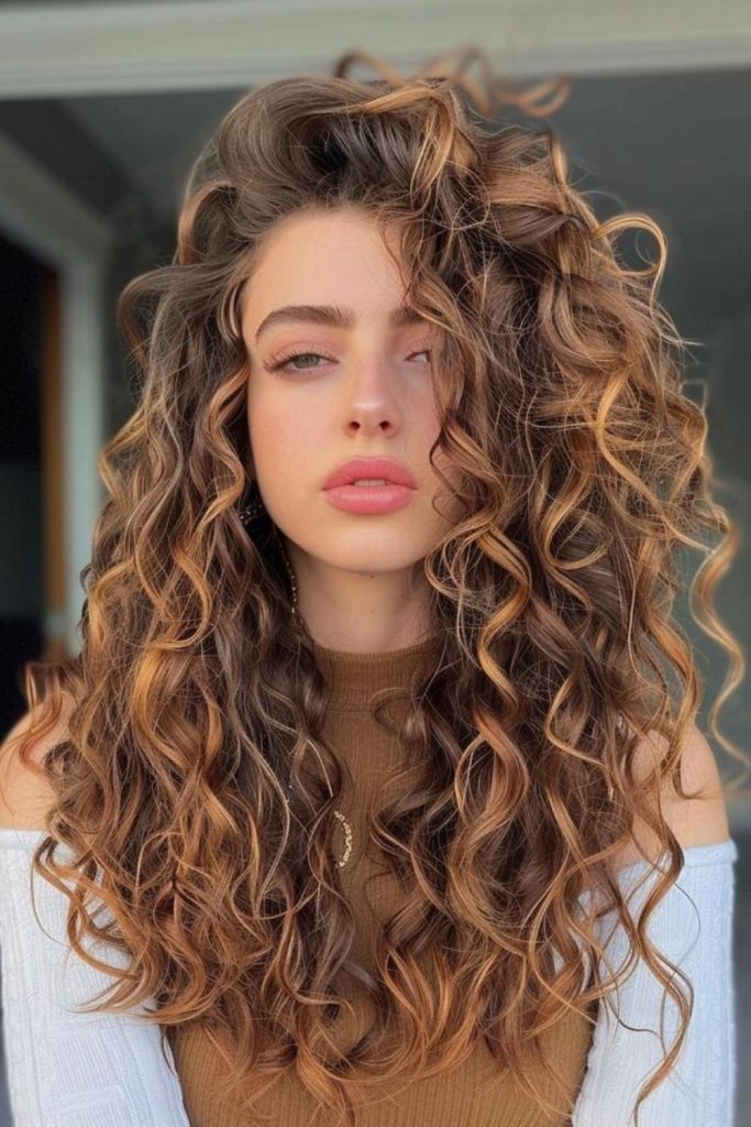 Caramel colored silky curls flowing with warm shine